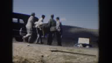 Texas (1951): People Are Carrying A Body Inside Of A Car In The Daytime