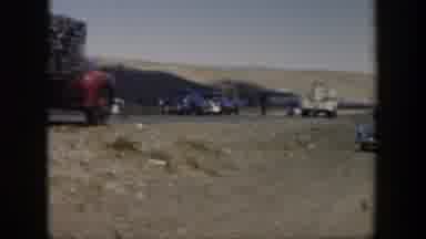 Texas (1951): Group Of Old Black Cars Stopped In The Middle Of The Road Along With