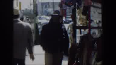 Texas (1951): Black Aviator Man Near Shop Warn Hand Point Out Landscape House
