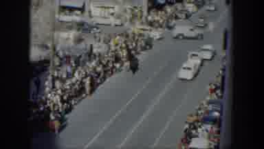 Texas (1951): Large Crowds Line City Streets On A Bright Sunny Day