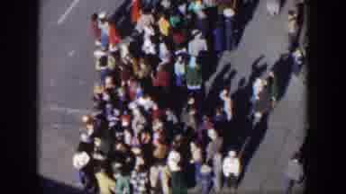 Texas (1951): Large Crowd Standing On Side Of Street On A Sunny Day