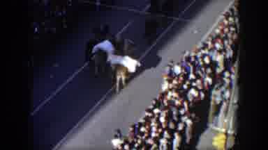 Texas (1951): Majorettes Wearing White Uniforms March In Parade On A Sunny Day