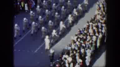 Texas (1951): View Above Parade Route Down City Street Crowds On Sides Of Street