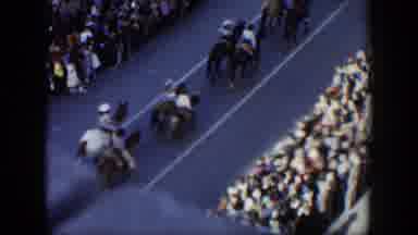 Texas (1951): People Riding Horses Down Street In Parade On A Clear Day
