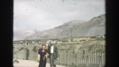 California-1937: Tourists Walking Along Dam While Water Flows Through Spillway