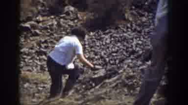 California (1937): Two Person Going Down A Steep Cliff In A Rocky Valley