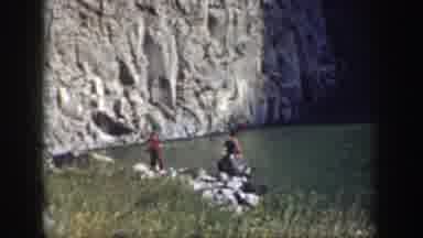 California (1937): People Walking And Climbing On Rocks At The Base Of A Waterfall