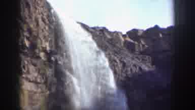 California (1937): A Cascading Waterfall Coming Down A Rocky Cliff Face And