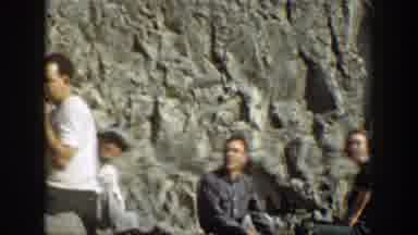 California (1937): People Sitting Next To Waterfall Man Lifting Stone And Doing
