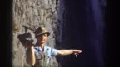 California (1937): Man Throwing A Rock Down The Slope
