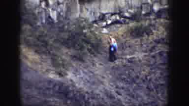 California (1937): Man Walking Down A Rock Cliff Side Shirtless Alone Carrying A