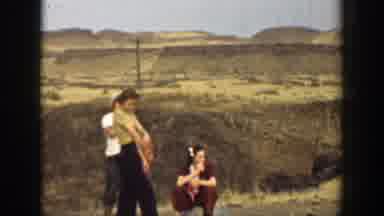 California (1937): Group Of People Have A Conversation In Mountainous Area A