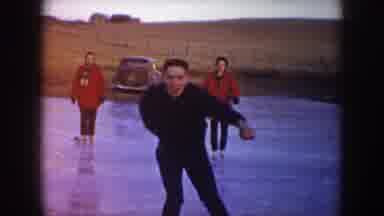 North Dakota (1953): People Skating On A Frozen Pond And Gliding Toward A Video