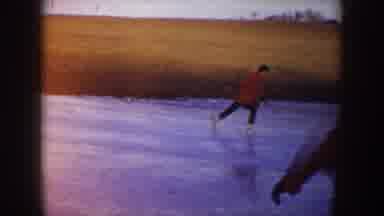 North Dakota (1953): Three People Skating On The Frozen Lake Two With Red Jacket