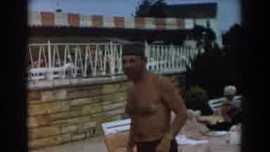 Los Angeles California-1961: Man Entering Pool in 1960s Swimwear