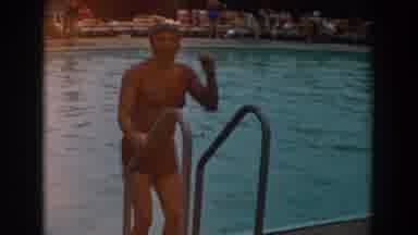 Los Angeles California-1961: Man Climbs Ladder Into Pool And Swims Away