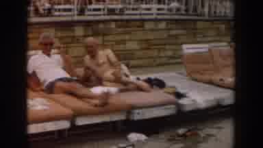 Los Angeles California-1961: Two Men Lounging by Pool on Hot Summer Day