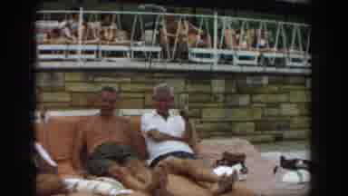 Los Angeles California (1961): Men Sitting Lounging Outside Relaxing passing The