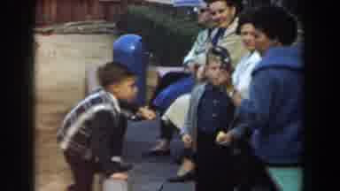 Los Angeles California (1961): Boy Wearing Black And White Sweater Grabs Small
