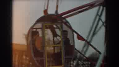 Los Angeles California (1961): Children Riding A Small Ferris Wheel In A Fair Or