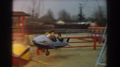 Los Angeles California (1961): Two Boys Ride In Blue Airplane Amusement Ride On A