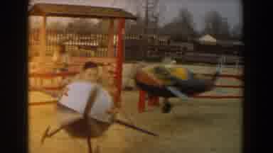 Los Angeles California (1961): Children Riding A Carnival Ride In An Airplane
