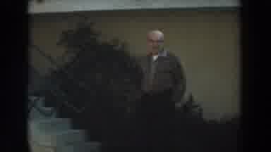 Los Angeles California (1961): Man Walking With Hands In Pockets Laughing At