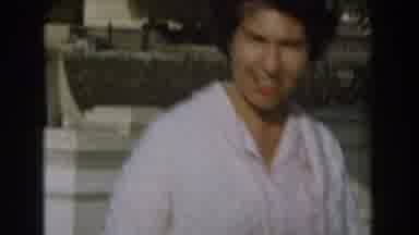 Los Angeles California (1961): A Woman In A White Dress Walks In A Yard With A