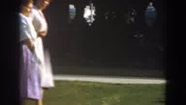 Los Angeles California (1961): A Boy Plays With A Toy As He Runs Up To Take His