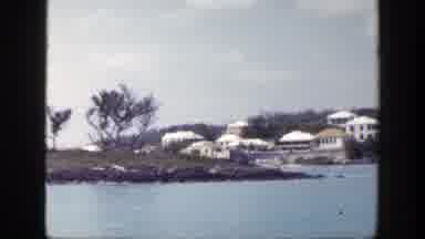 New York (1948): View Of White Buildings Blue Sea Water And Trees On A Cloudy Day