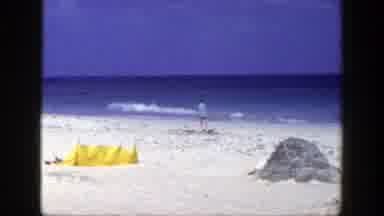New York (1948): Men Walking By The Beach On Tropical Shoreline With Blue Sky