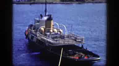 New York (1948): Large Ship With Steam Coming From Top Docked In The Water