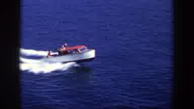 New York (1948): People Take A Ride On A Red And White Motorboat In Open Ocean