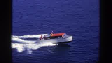 New York (1948): Red And White Boat Sails Along Body Of Water Front Of Boat Raised