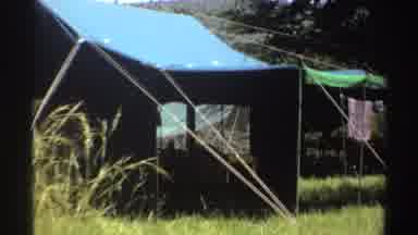 Nigeria (1969): A Video Zoom In Shot On A Tent Outside In The Sun