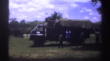 Nigeria (1969): People Around Truck Helping Take Out Hay
