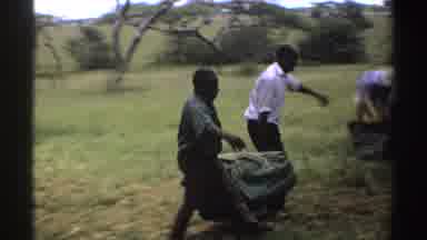 Nigeria (1969): Men In A Grassy Clearing Handling Building Material