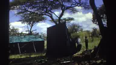 Nigeria (1969): Filming Men In The Forest Setting Up The Tent For The Night