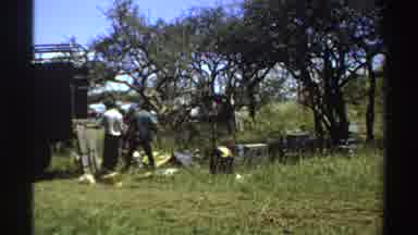 Nigeria (1969): People Unloading Truck Grass Nature Outdoors Three Men Loading