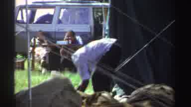 Nigeria (1969): Two Men Setting Up Something Like A Clothesline In A Yard