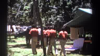 Kenya (1969): Men In Orange Uniforms Walking By An Exotic Animals Enclosure