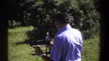Kenya (1969): Man With A Camera Changing His Position In Nature
