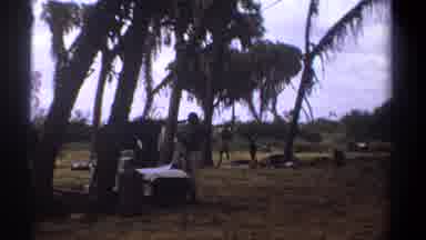 Kenya (1969): Men Gathered Together In White Clothes On A Beautiful Day In Green