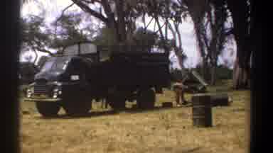 Kenya (1969): Two Men Working On A Field Packing The Product To Put On The Truck