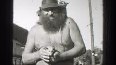 California-1939: Bare-Chested Man With Massive Beard Holding Mouse
