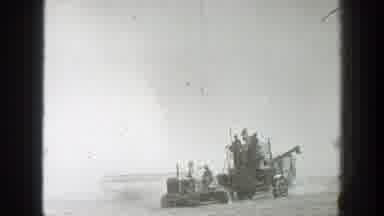 California (1939): Man Walks Alongside Of Harvester Machine On A Bright Sunny Day