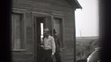 California (1939): Men Walking Out Of A Small Wood Building And Into A Field With