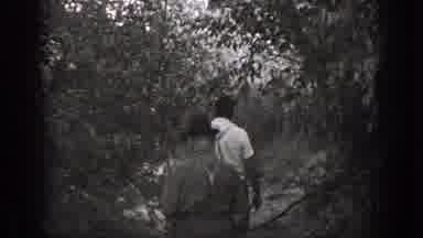California (1939): Black And White Footage Of Two Men In Suspenders Walking