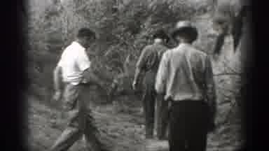 California (1939): Man Wearing White Shirt Prepares To Enter Wooden Shack On A