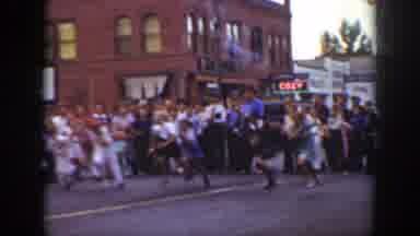 California (1939): Race Start With Crowd Watching In The Middle Of The Street